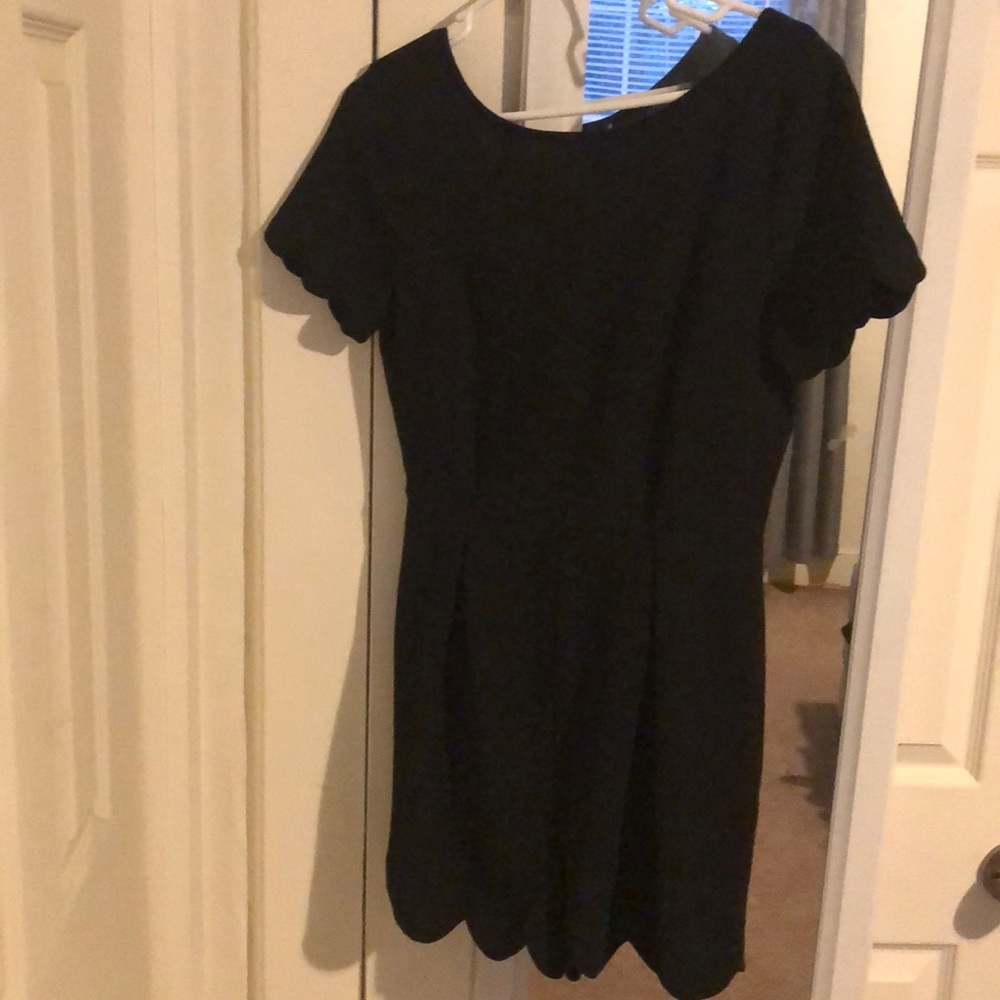 Black romper with scallop sleeves and bottoms